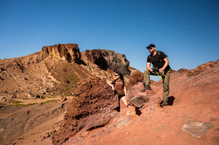 A man and a woman on a sunny day in the rocky dessert