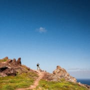Christoph on a hiking trail, blue sky, rocky desert