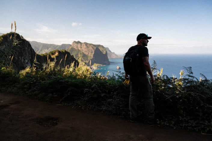 Silhouette of Christoph, the stunning coastal landscape of Madeira island in the background