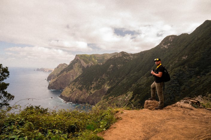 Christoph with binoculars looking along the Northern shore line of Madeira island