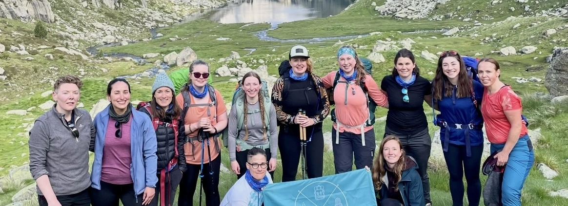 Kate Capelli and her Adventuresses hiking in the mountains