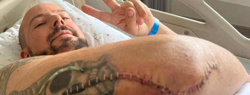 Christoph in hospital bed after the surgery